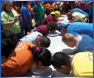 VTC individuals participating in pie eating contest at the annual Spring Fling event