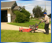 Individual mowing residential lawn