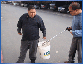 VTC individuals using nabbers and bucket to pick up trash
